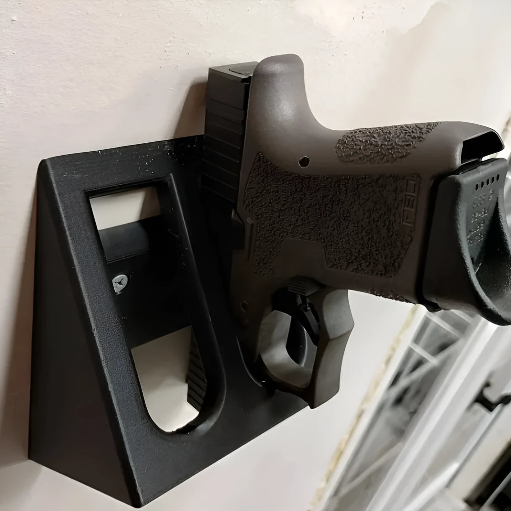 Black plastic punk-style pistol stand for displaying replica firearms.