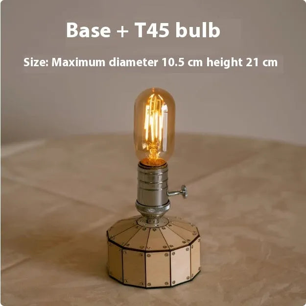 Retro wooden base bedside lamp with glass shade and USB charging cable on a table.