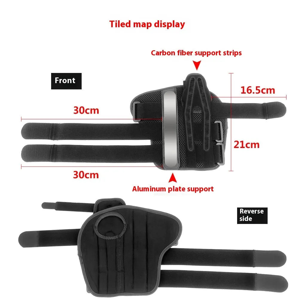 Black carbon fibre sports wrist guard with grey edging and an adjustable thumb strap laid flat.