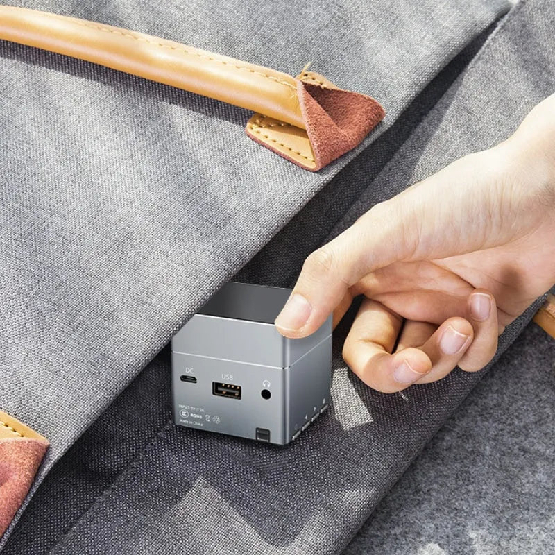 Small portable HD projector with wireless hand connection and 3400mAh battery for outdoor camping