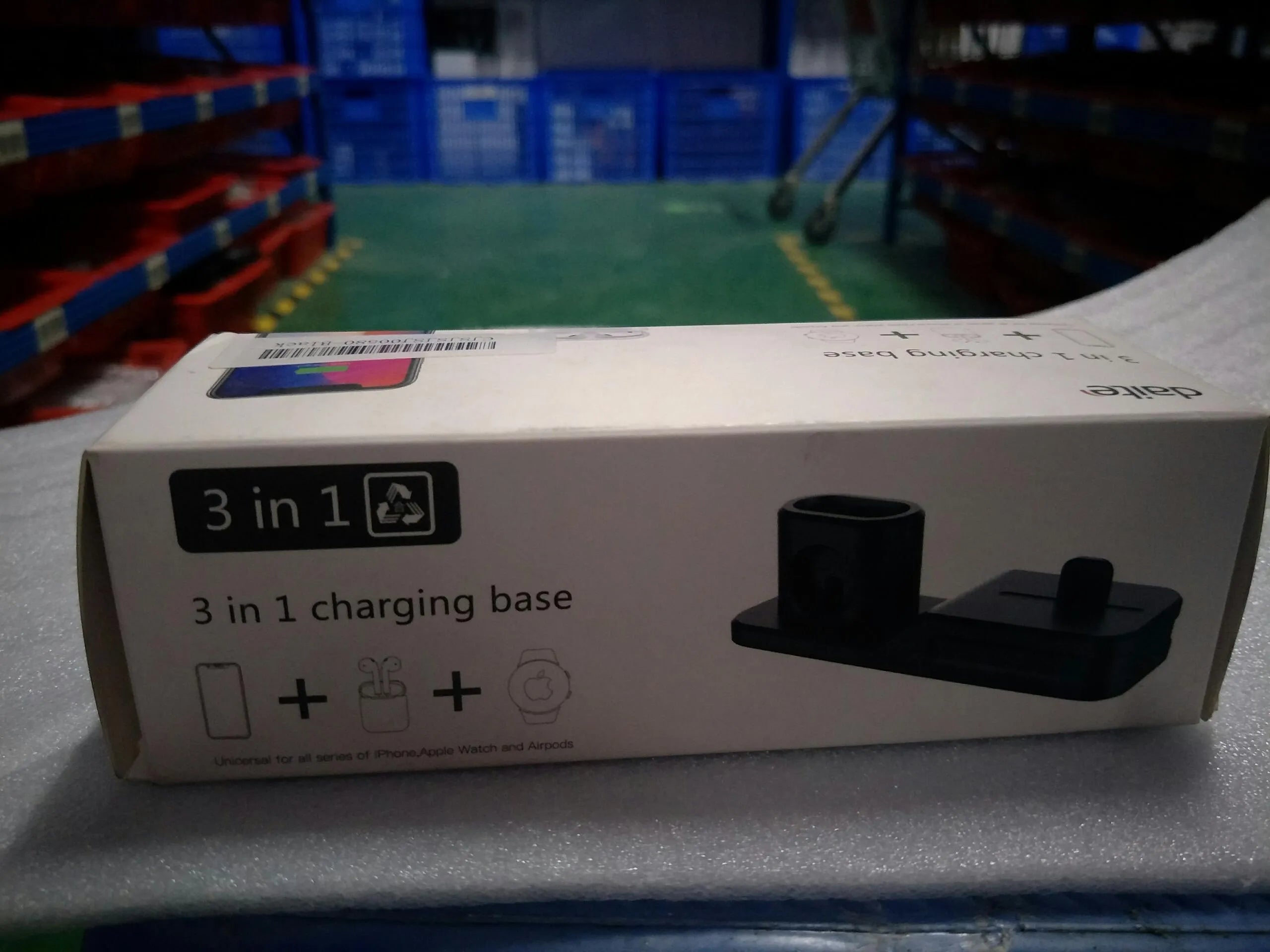 Black geometric 3-in-1 charging station for Apple devices showing iPhone, iwatch and AirPods charging slots