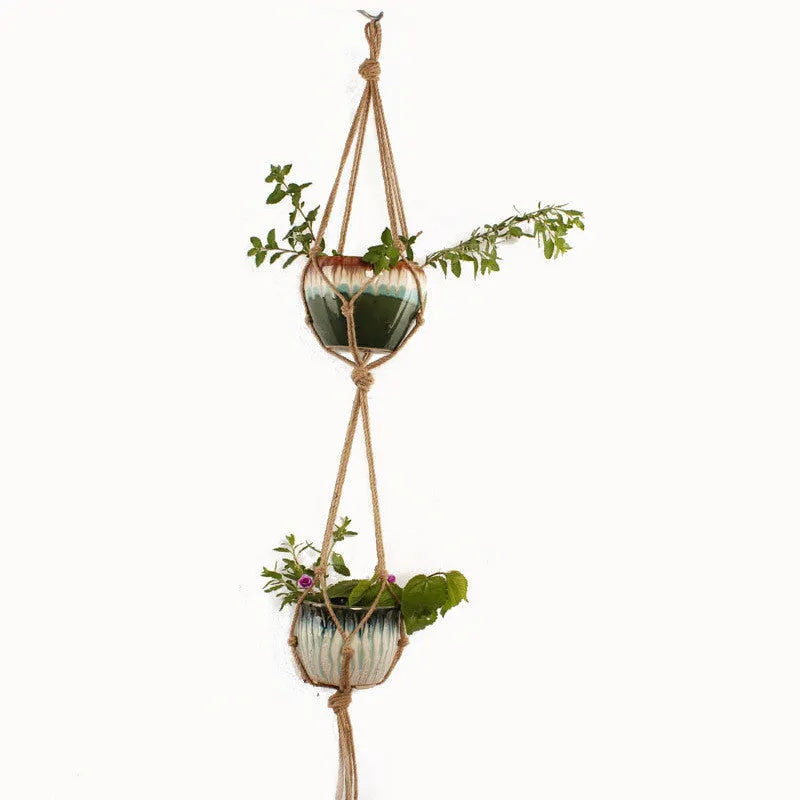 Woven wire plant hanger bracket with cotton rope, shown in a rustic style suitable for wall mounting.