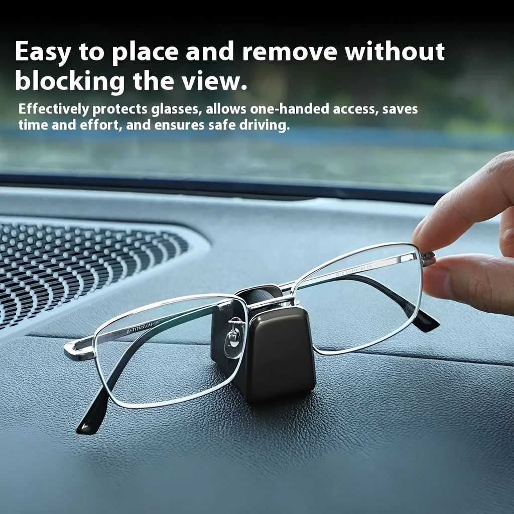 Zinc alloy and leather car dashboard glasses clip holder in green, shown on a car dashboard.