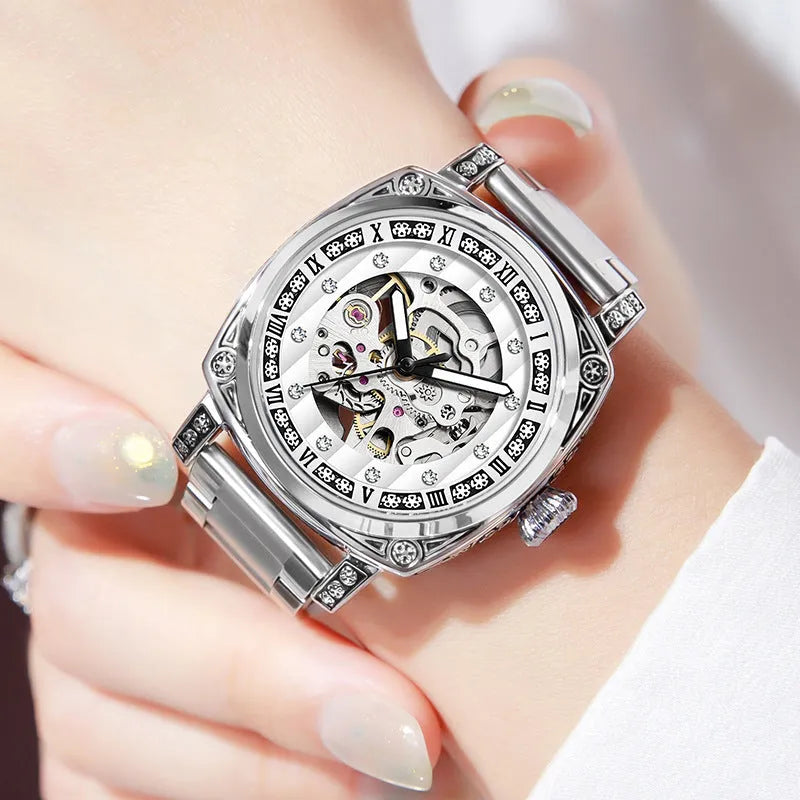 Mechanical wristwatch with luminous dial on a leather strap, shown in multiple colour options.