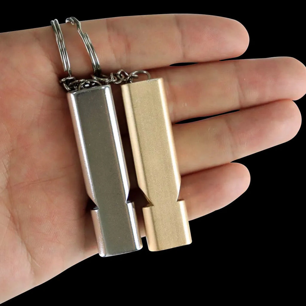 Gold and silver aluminium alloy double-hole survival whistle on a keyring.