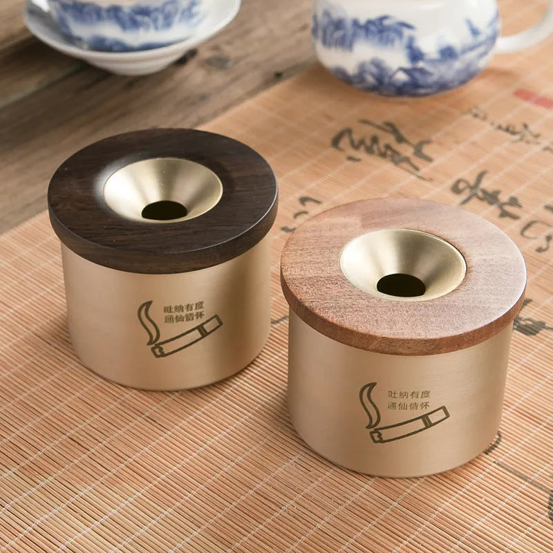 Copper retro ashtray with wooden lid showing central hole for ash collection