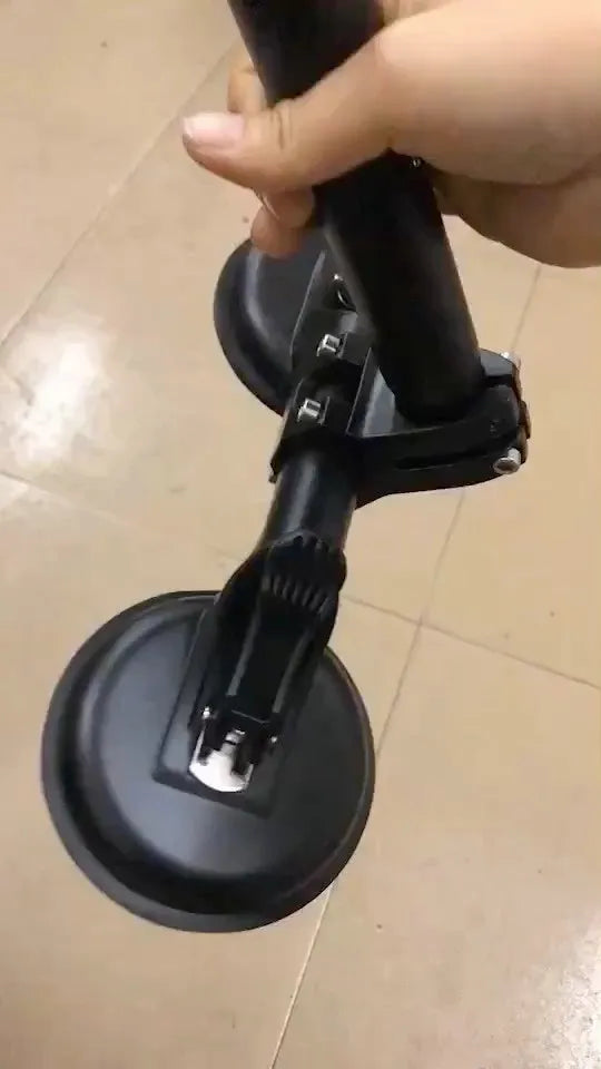Black off-road car windscreen sucker mount with a large round rubber suction cup for flagpoles.