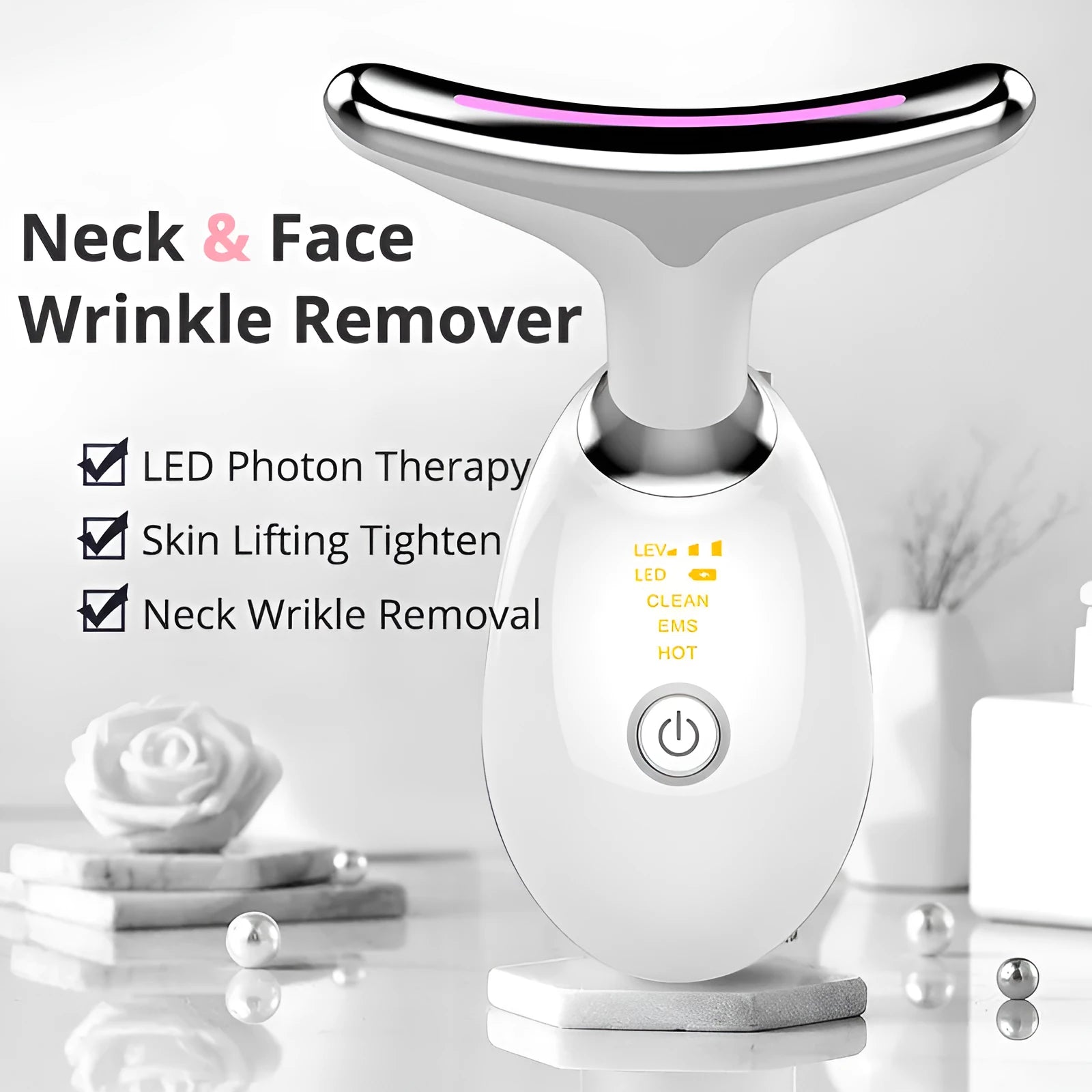 White EMS thermal neck massager device with LED lights on a skincare stand.