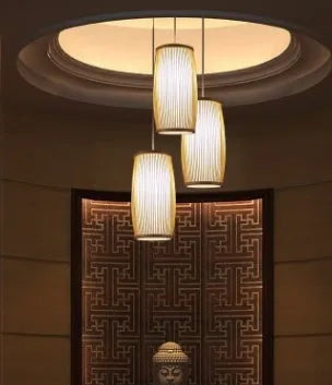Natural bamboo wall light fixture with a woven shade, measuring 15cm wide and 35cm tall.