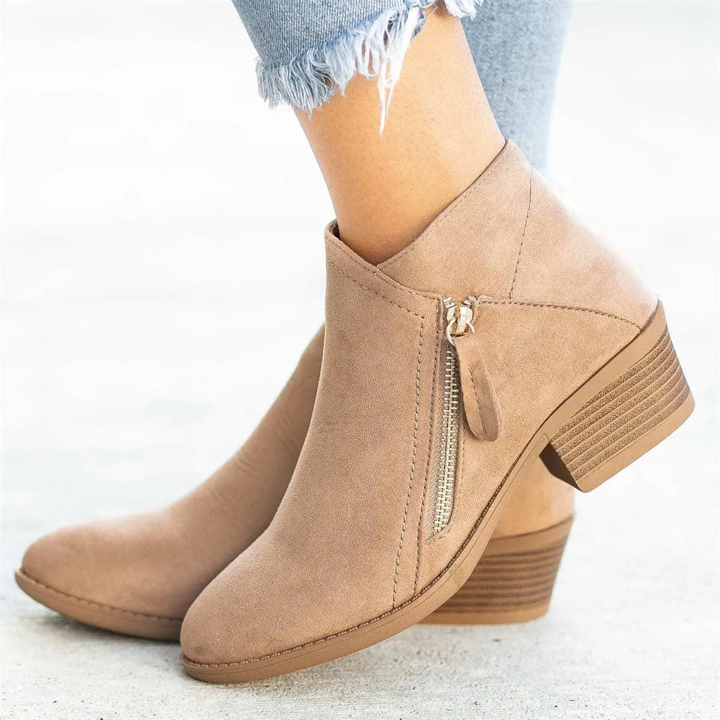 Women's suede ankle boots with a chunky heel and side zip, shown in beige, black, blue, and orange colour options.