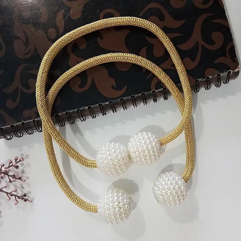 Magnetic curtain tiebacks with pearl beads in multiple colour options on white background