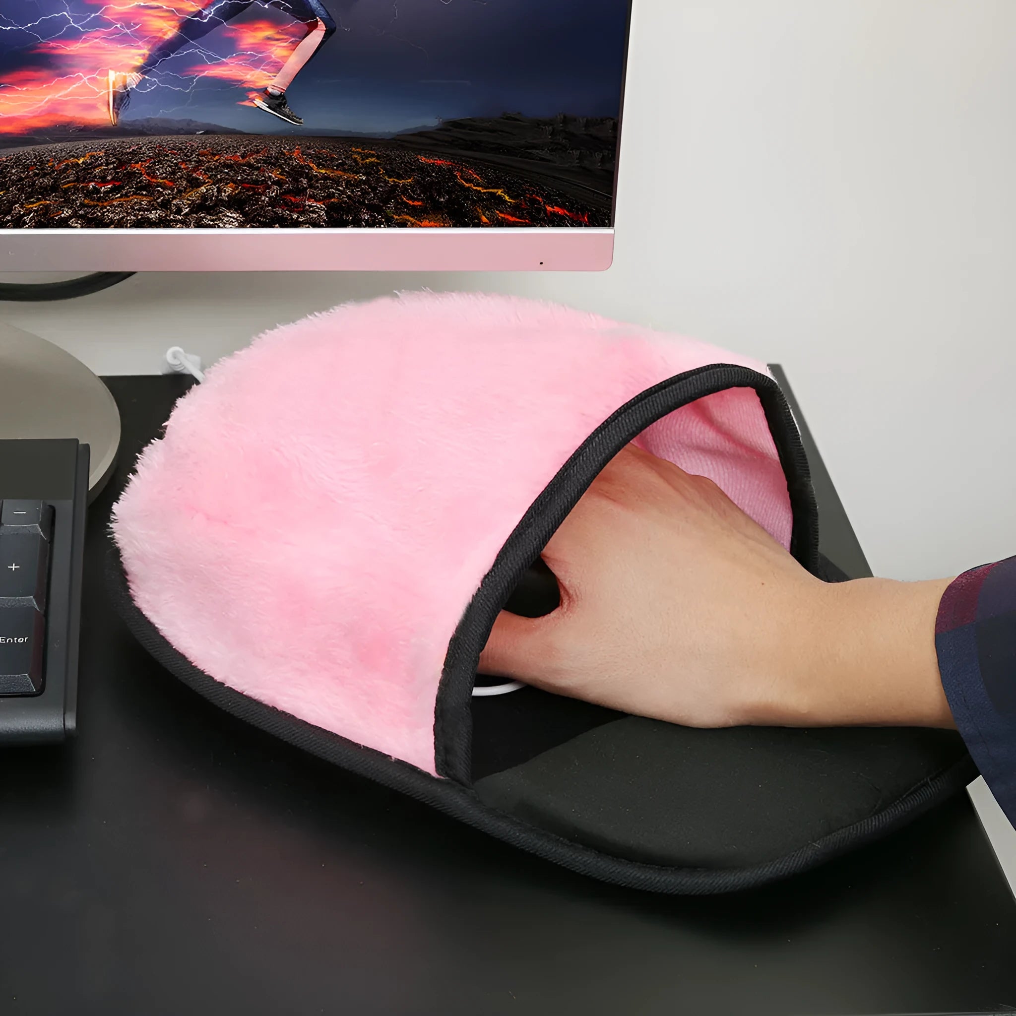 USB heated mouse pad with built-in warmer in black and pink on a desk