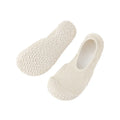 Women's low-top indoor fitness shoes in a solid colour with a mesh upper and soft rubber sole.
