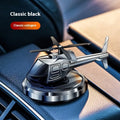 Silver metal solar helicopter car perfume ornament spinning on a car dashboard