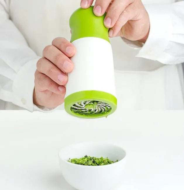 PP plastic and stainless steel herb grinder mill with removable top on a kitchen counter