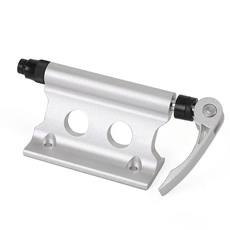 Silver metal quick release fixing clip for bicycle front fork on a white background