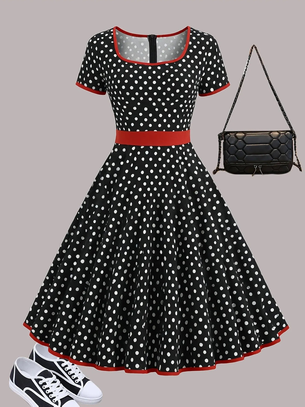 Multicolour polka dot pleated dress with square collar and short sleeves on a hanger.