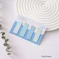 Set of four magnetic morandi colour block bookmarks in soft pastel hues on a page