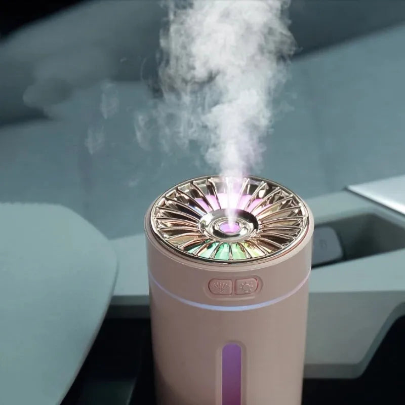 Black portable car humidifier with colourful lights on a car dashboard cup holder