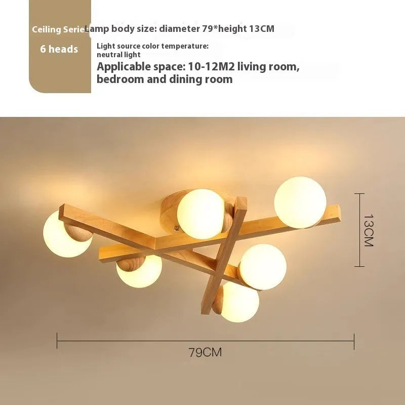 Wooden style modern Nordic ceiling light with three heads, installed in a living room.