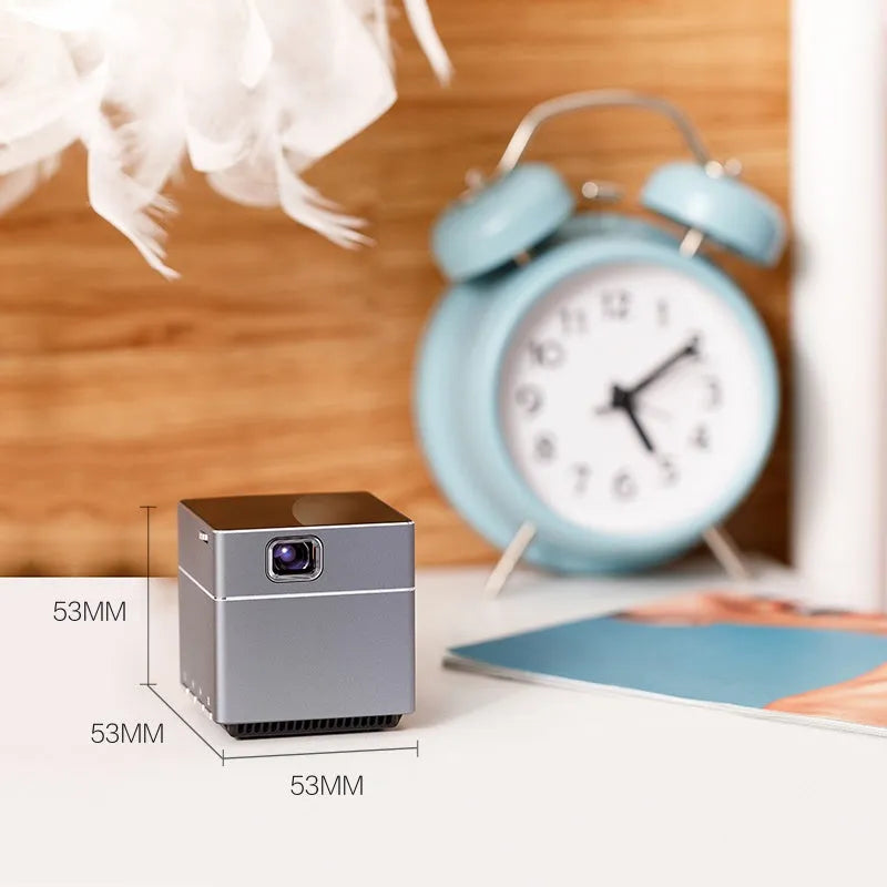 Small portable HD projector with wireless hand connection and 3400mAh battery for outdoor camping