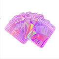 Laser internal printing ziplock bag in pink, 10x15cm size, with colourful internal print, lying flat on a surface