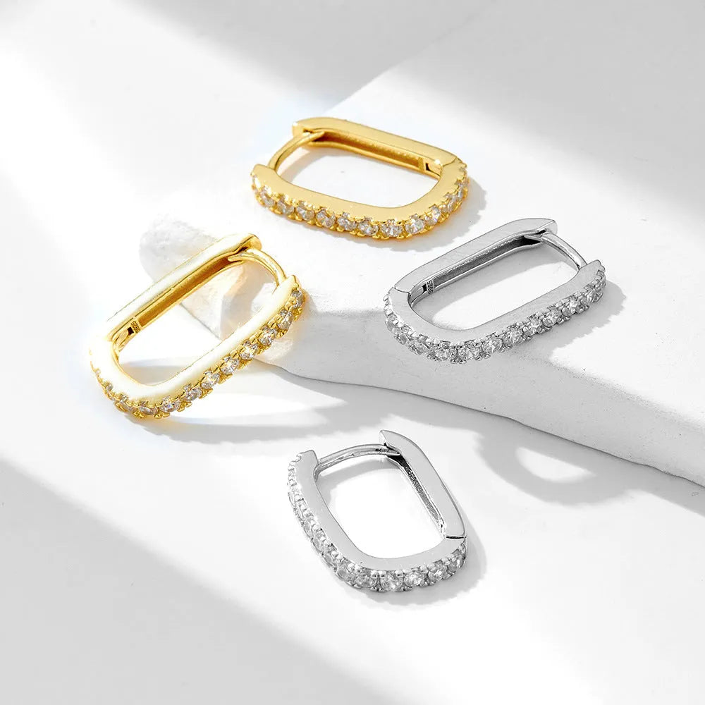 Sterling silver oval geometric ear clips with zircon stones in white or yellow finish