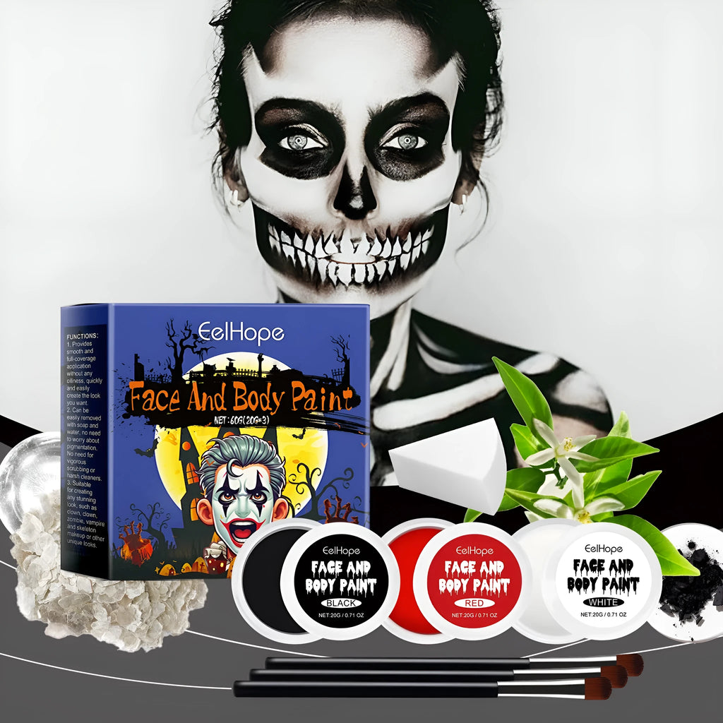 Halloween palette suit with red black white cream foundation palettes, three brushes, and a sponge on a dark background
