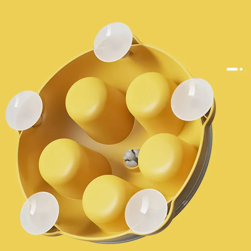 Yellow pet entertainment plate for cats serving as dual-purpose snack bowl and interactive toy