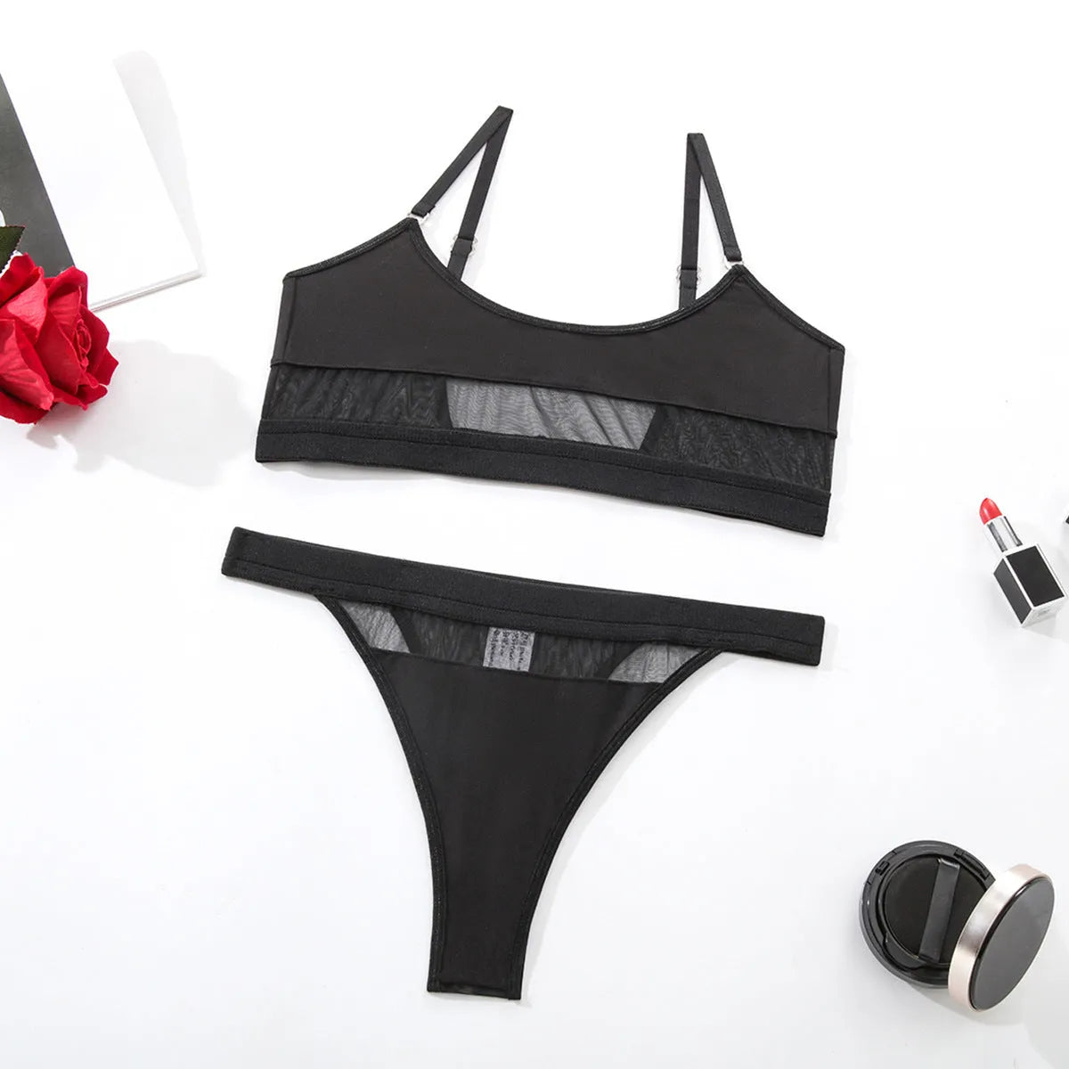 Black women's full cup bra and knicker set with adjustable straps on a white background