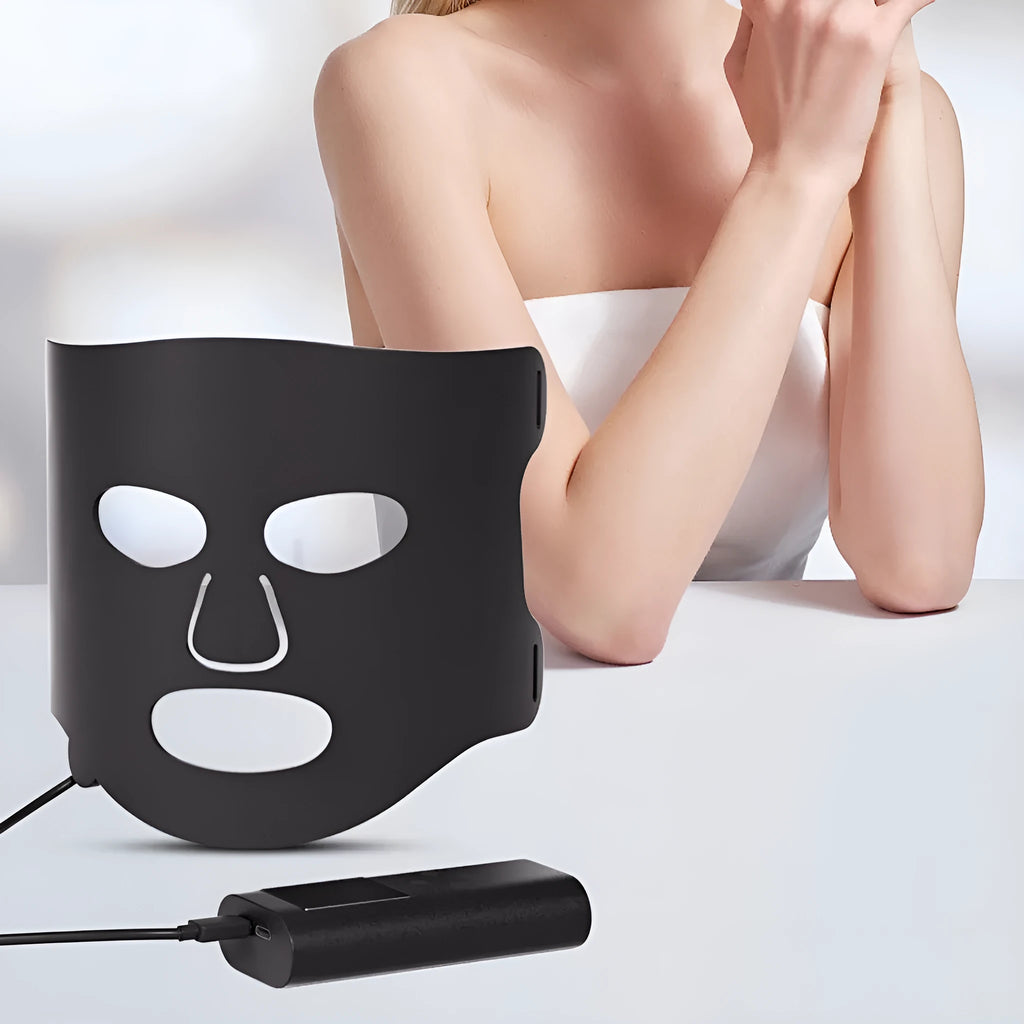 White and black LED phototherapy face mask with controller showing seven colour light modes for skin treatment
