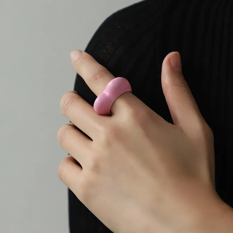 Colourful three-dimensional enamel heart ring on a zinc alloy band.