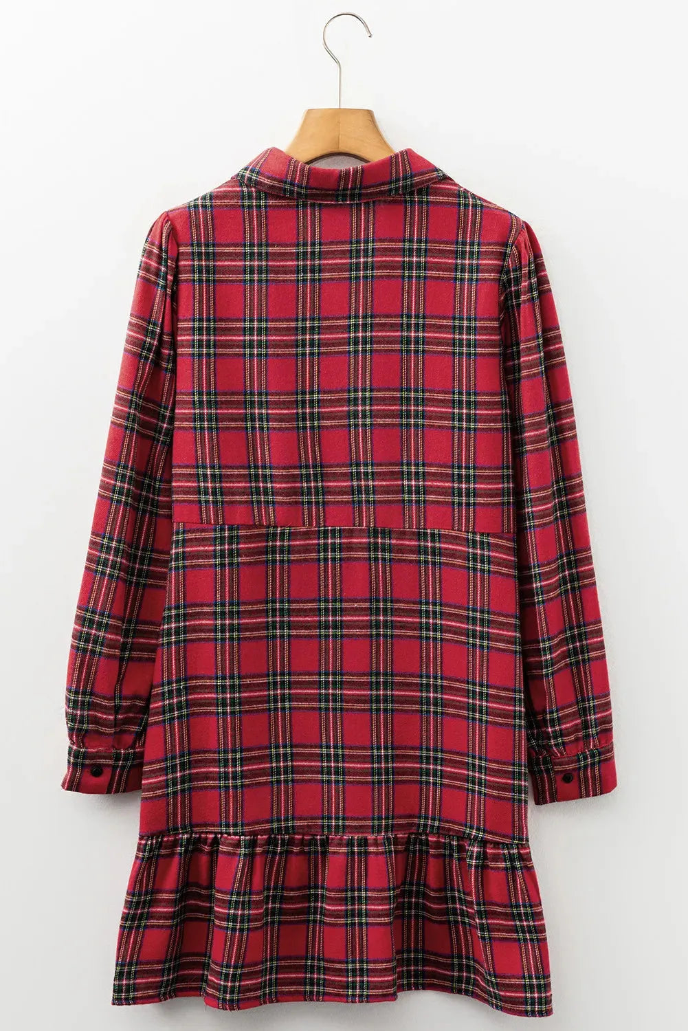 Red plaid patterned women's mini dress with a shirt collar, long sleeves, half-button front, and a ruffle hem.