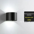 Modern aluminium LED wall lamp in a black finish mounted on a wall.