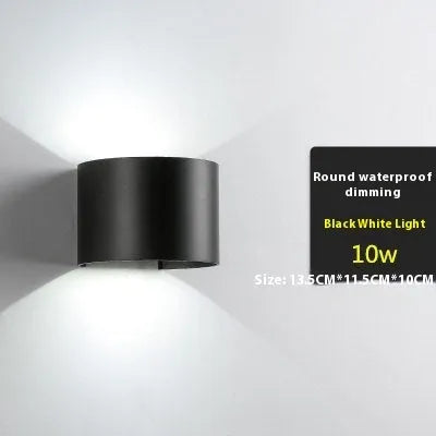 Modern aluminium LED wall lamp in a black finish mounted on a wall.