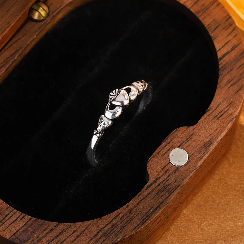 Retro silver copper open ring for women featuring a detailed heart shape design on an adjustable band.