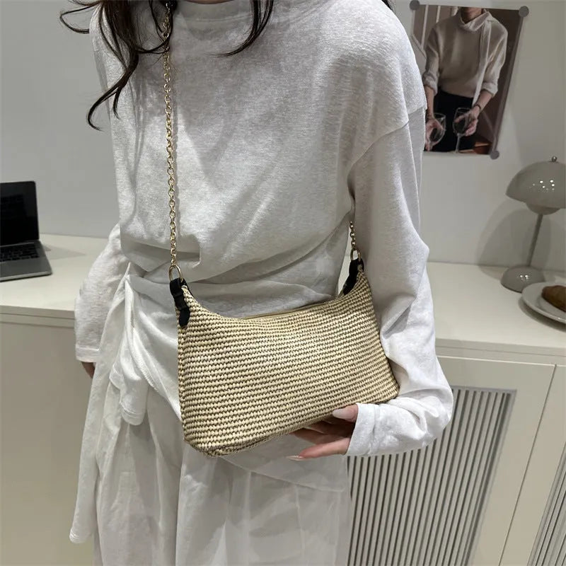 Woven straw shoulder tote bag in khaki colour with sandwich pocket design and internal phone compartment