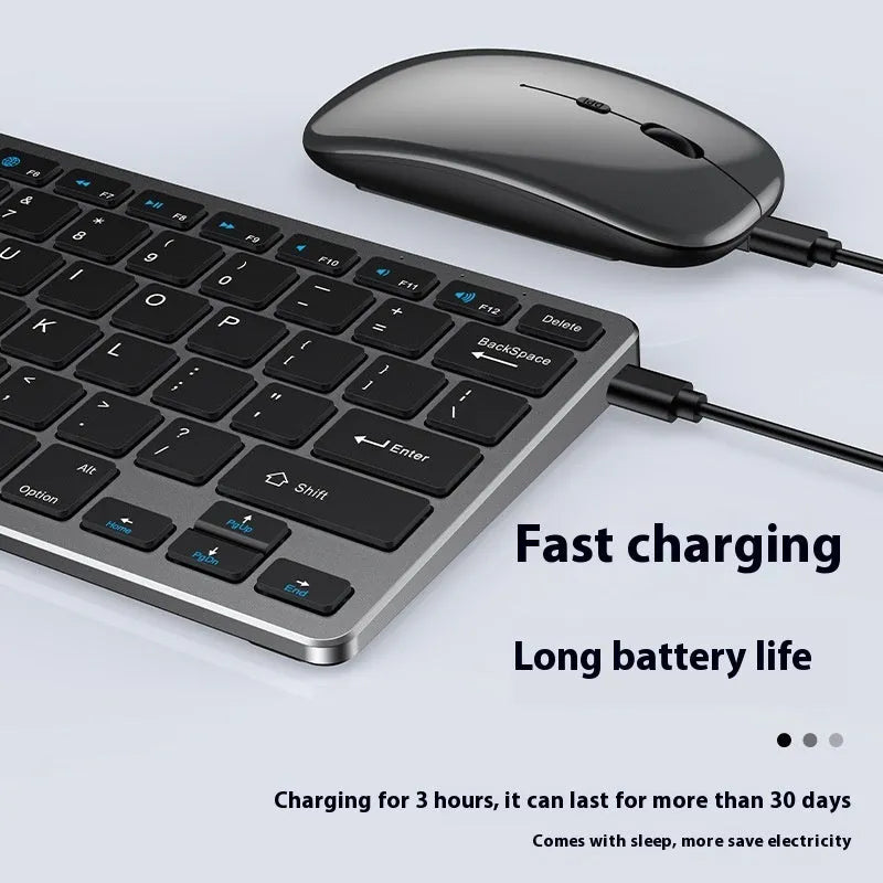 Black ultra-thin rechargeable wireless keyboard and photoelectric mouse combo set with USB receiver on a desk.