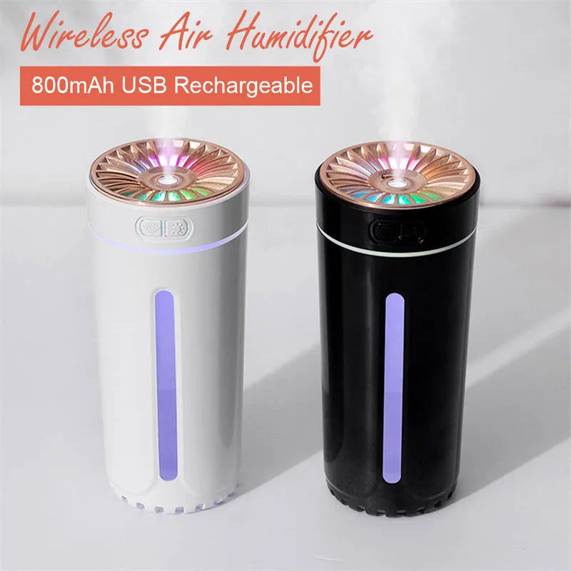 Black portable car humidifier with colourful lights on a car dashboard cup holder