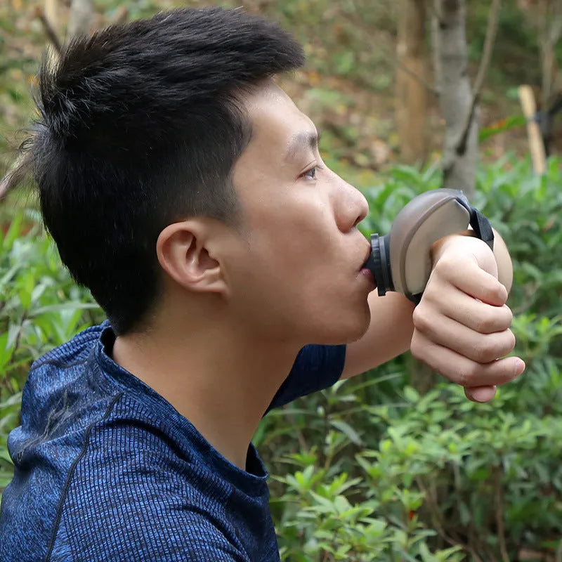 Black silicone wrist water bottle with adjustable Velcro strap shown on a wrist, 200ml capacity for sports.