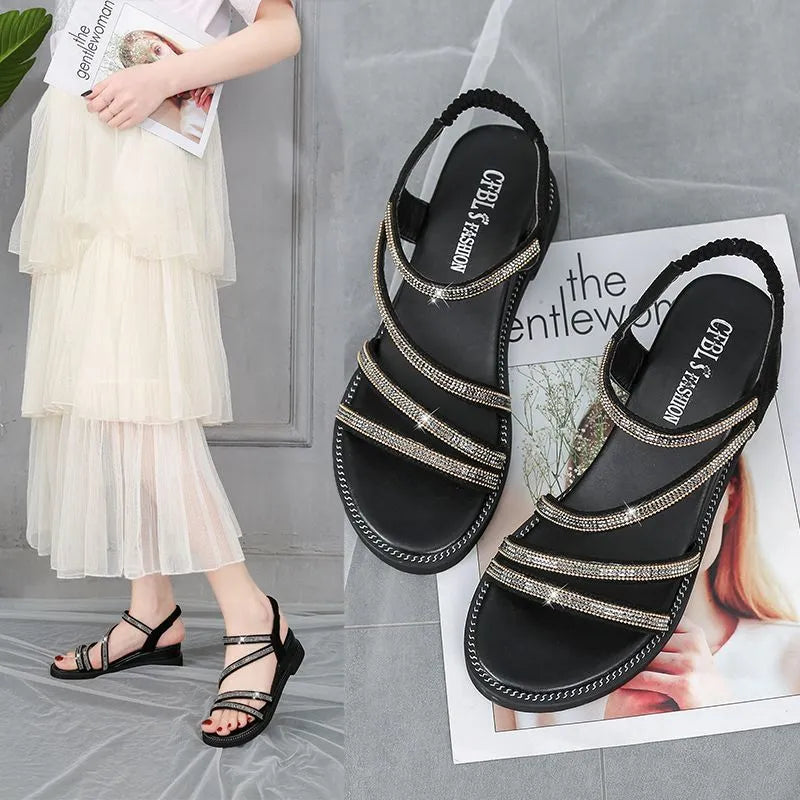 Women's silver Korean-style flat sandals with rhinestone details and an elastic strap.