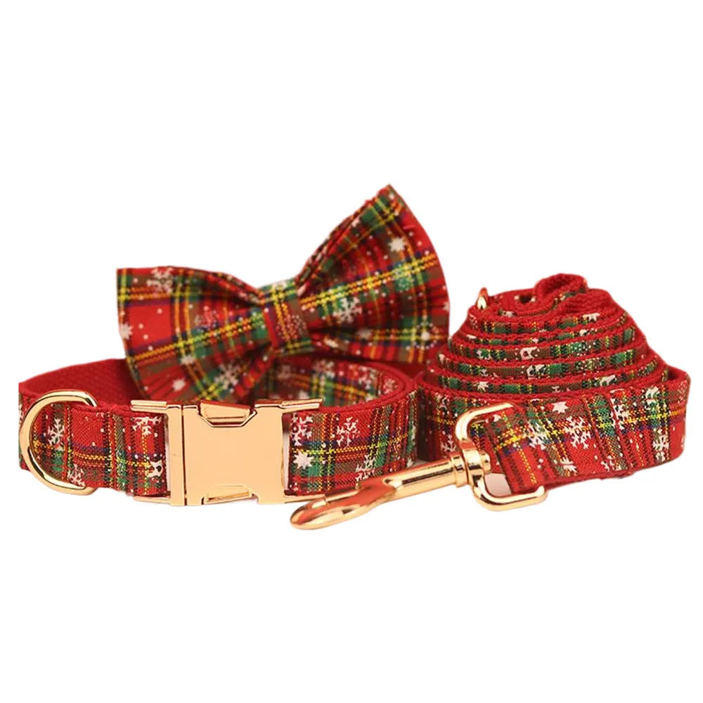 Red Christmas dog collar and leash set with snowflake design, plaid rope, floral bows, and matching vest