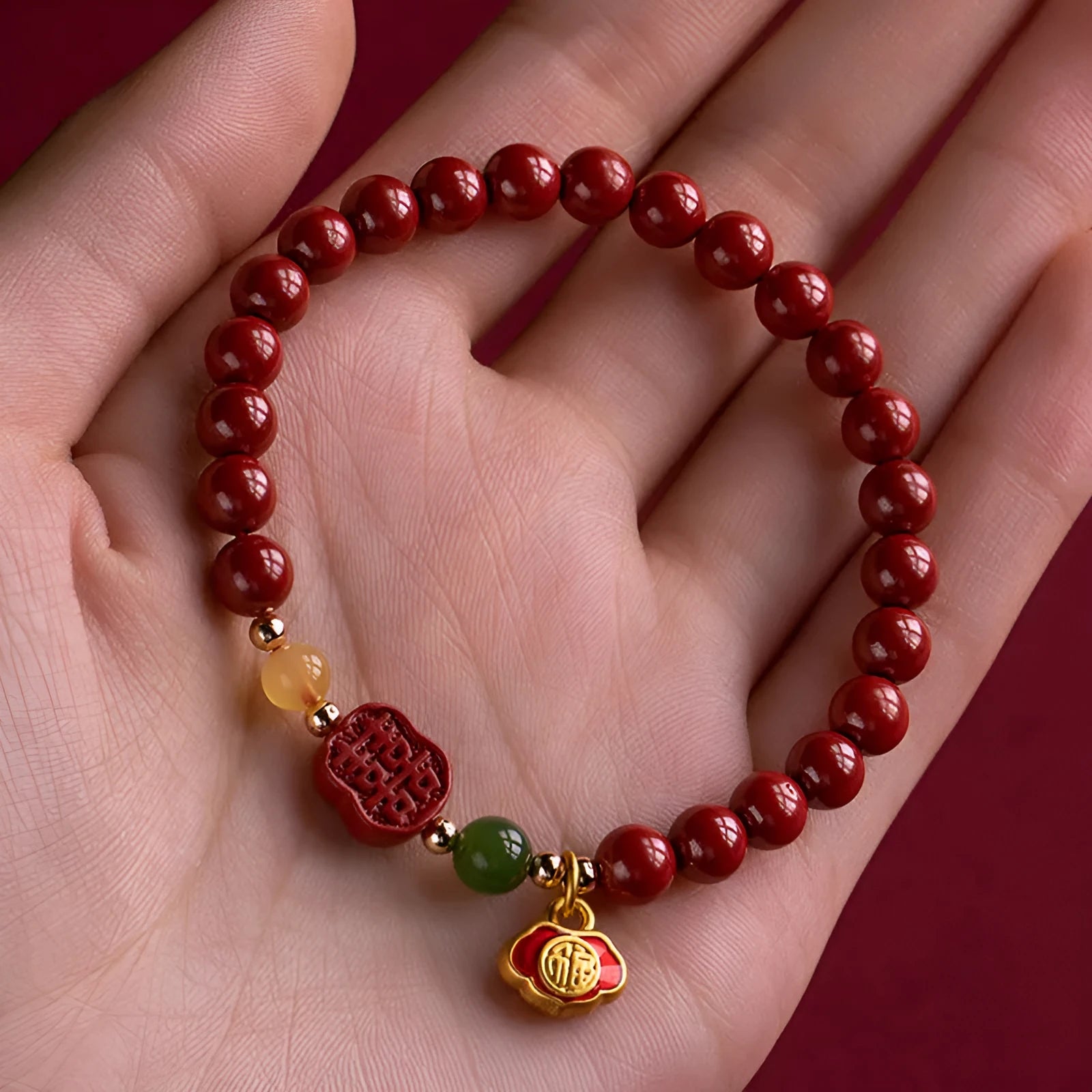 Emperor sandstone cinnabar bracelet with fu charm in 6mm and 8mm bead sizes.