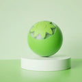 Green rolling ball electric pet toy for dogs and cats on indoor floor surface