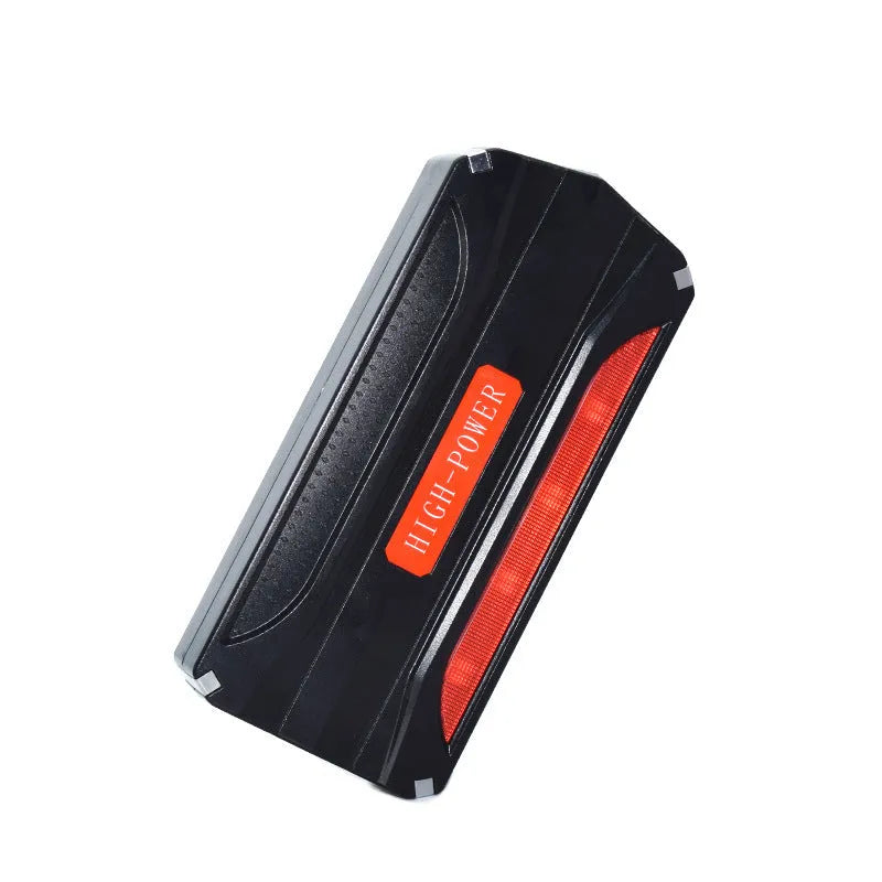Black and red emergency vehicle jump starter power supply unit showing compact dimensions