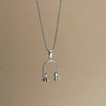 Alloy headphone necklace pendant on long chain, casual unisex accessory with electroplated finish