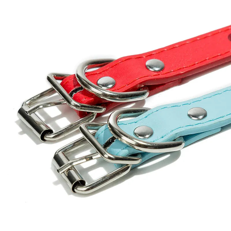 A studded PU leather dog collar in one of six colours with an alloy fastener, shown next to a size chart.