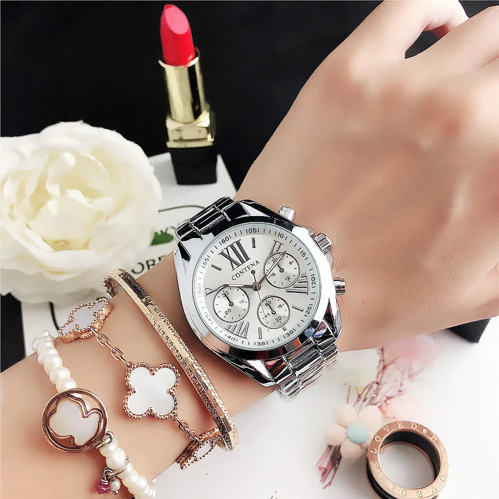 Women's silver rose gold quartz watch with diamond crystal mesh strap and analogue display.