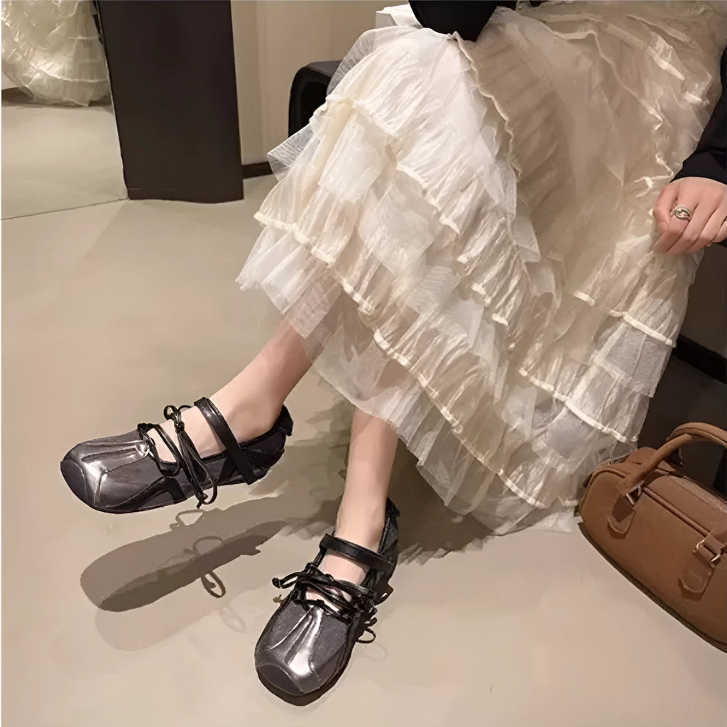 Women's beige vintage Mary Jane ballet shoes with lace-up front and a medium block heel.