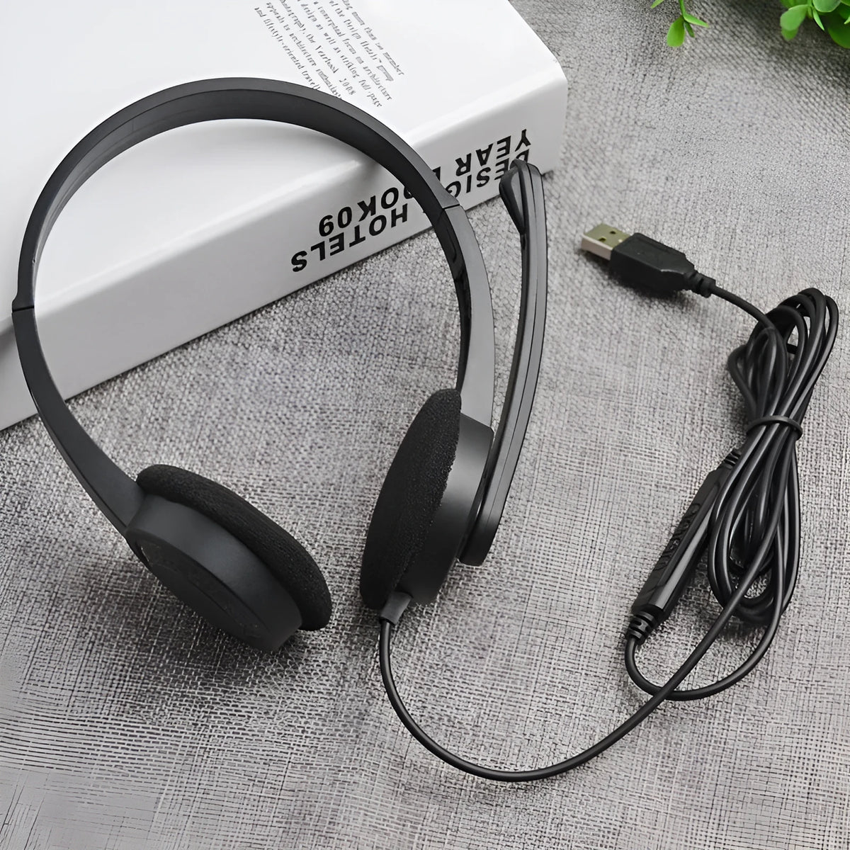 Black USB wired gaming headset with microphone, sponge ear pads and PVC cable for PC computer use